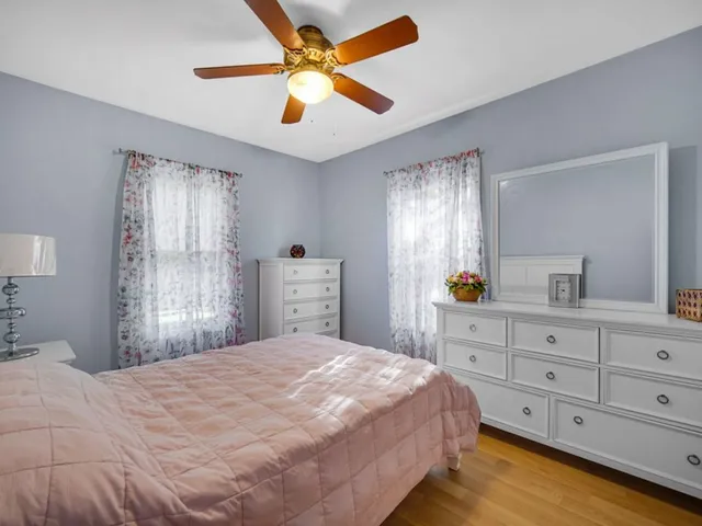 a bedroom with a large bed and a window