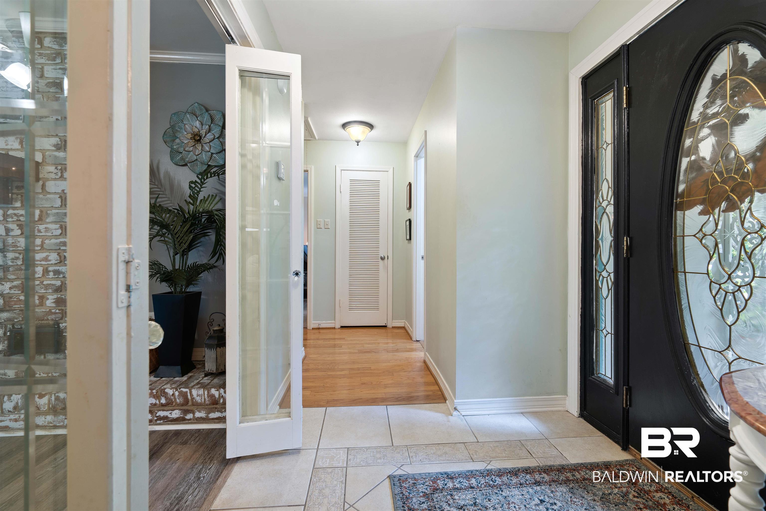 4051 East Canal Circle Mobile, AL 36619 - Photo 25 of 32 Foyer entrance featuring light tile patterned floors