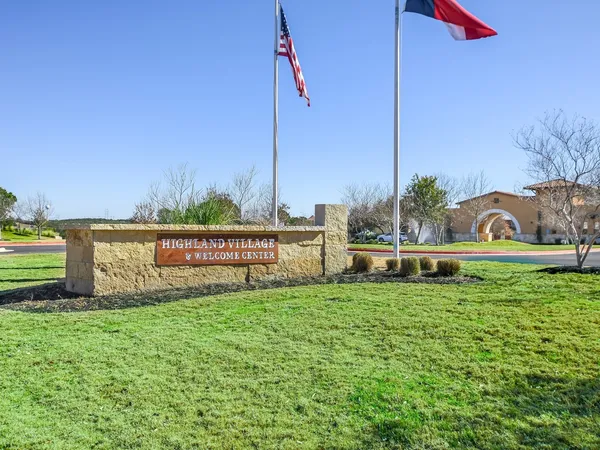 a view of a park with iron fence