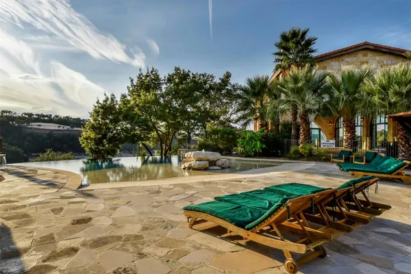 a view of a swimming pool with lounge chair