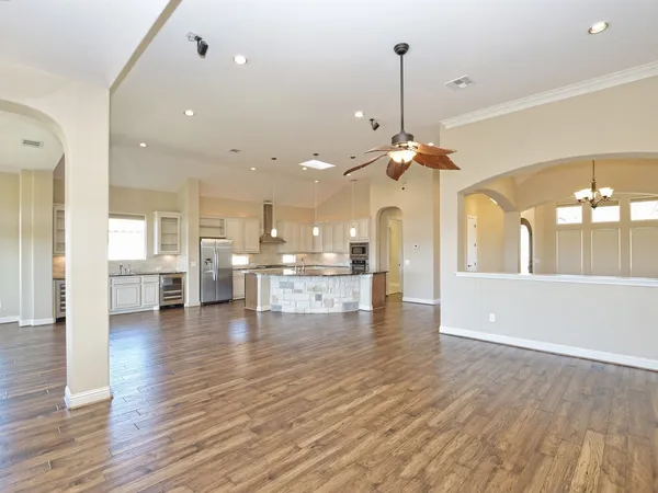 a view of a living room and kitchen view
