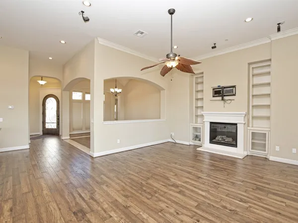 a view of a livingroom with a fireplace and window