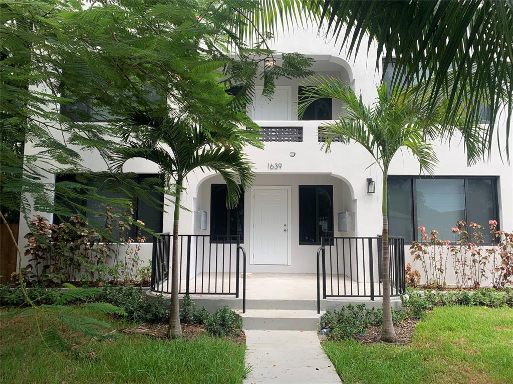 1639 Madison Street, Unit 11B Hollywood, FL 33020 - Photo 2 of 8 a front view of a house with a porch
