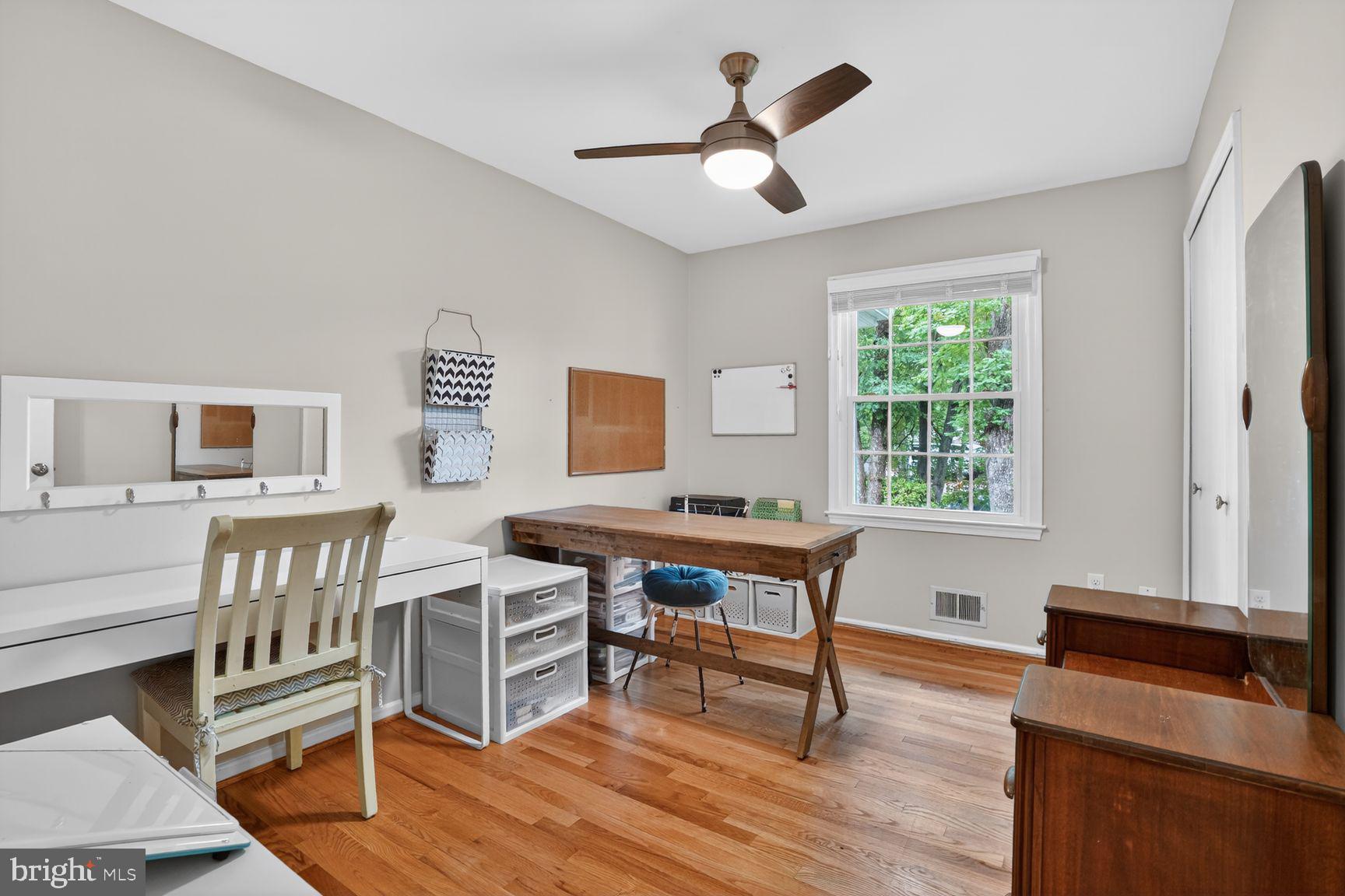 5024 Portsmouth Road Fairfax, VA 22032 - Photo 21 of 38 a work room with furniture wooden floor and a window