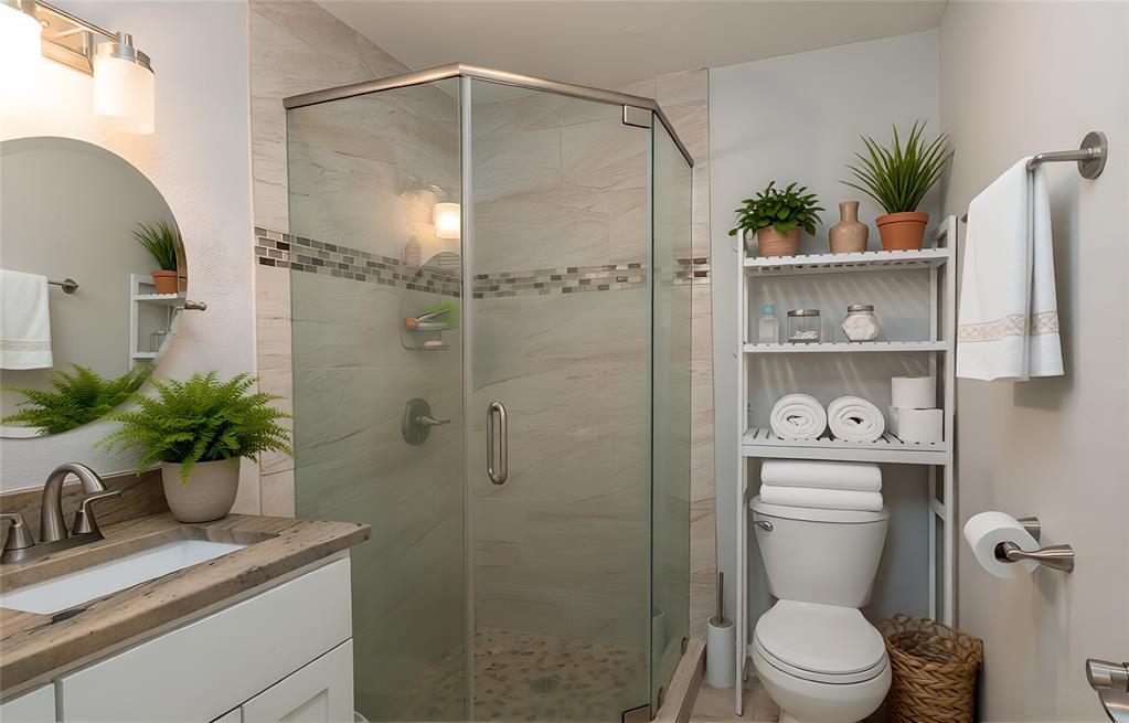 13 Crestview Circle Rockwall, TX 75087 - Photo 31 of 37 a bathroom with a sink a toilet and shower