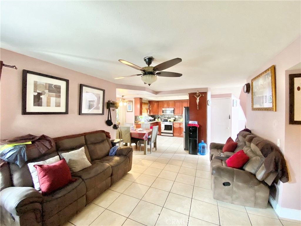 1444 North Sage Avenue Rialto, CA 92376 - Photo 13 of 22 a living room with furniture and wooden floor