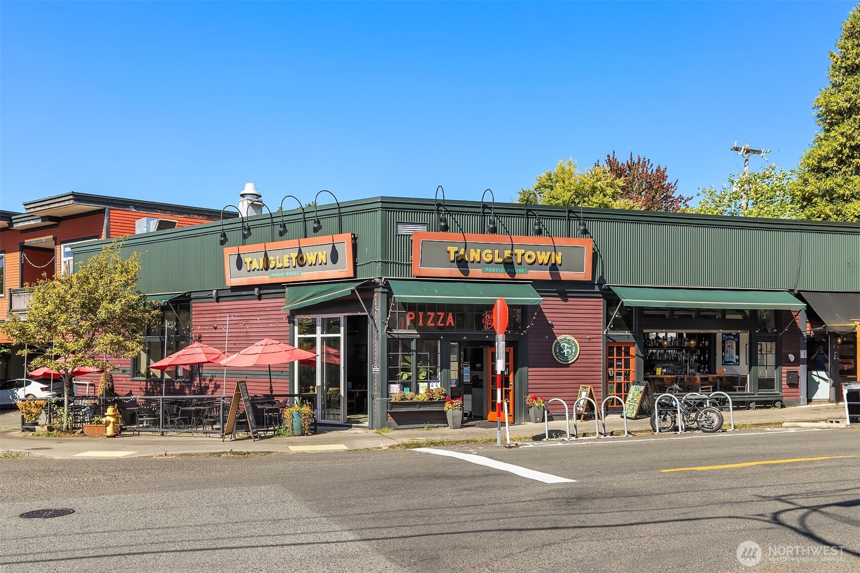 133 Northeast 60th Street Seattle, WA 98115 - Photo 15 of 16 a view of street with shops