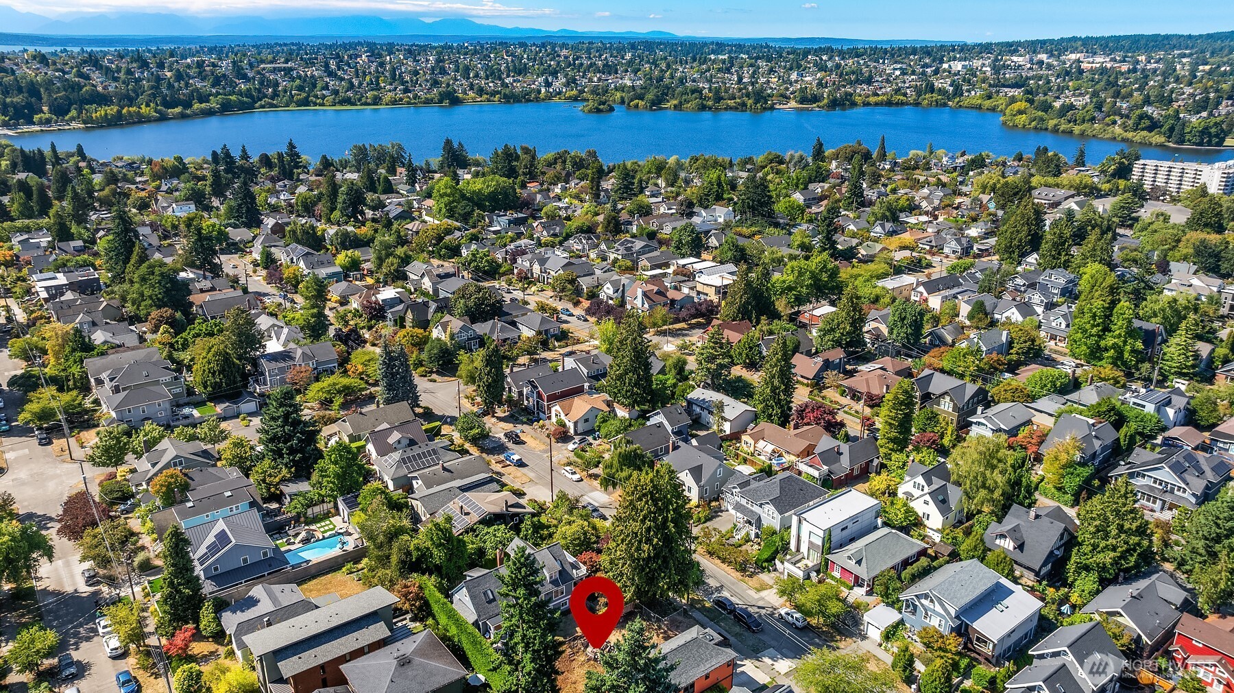 133 Northeast 60th Street Seattle, WA 98115 - Photo 4 of 16 an aerial view of a house with a lake view