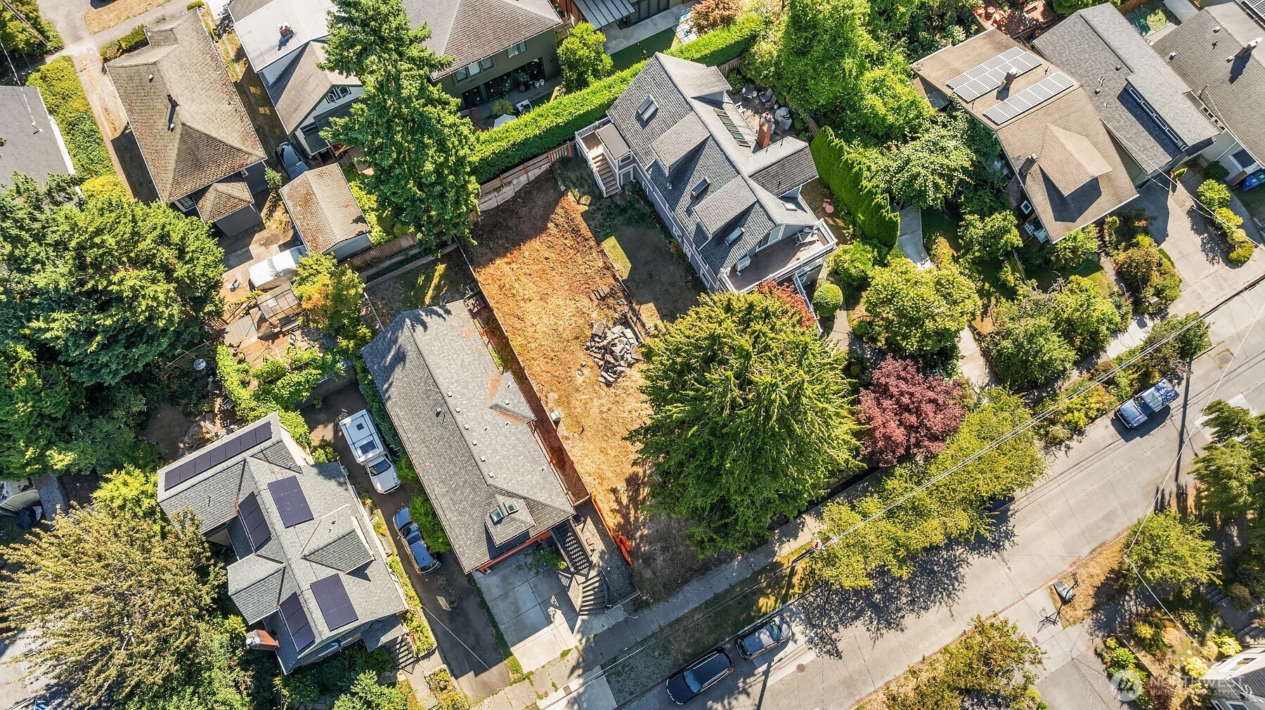 133 Northeast 60th Street Seattle, WA 98115 - Photo 9 of 16 an aerial view of a house with a yard and garden