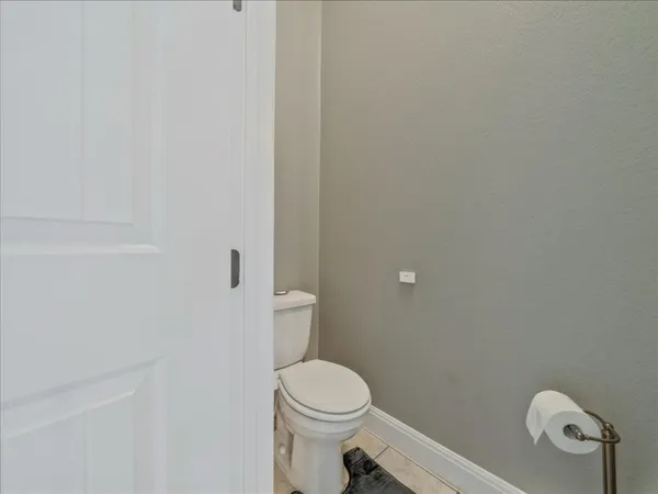 a bathroom with a granite countertop sink a mirror and a shower