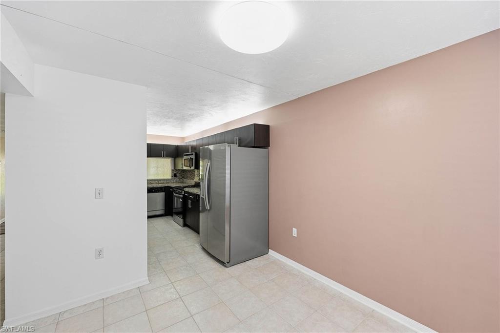 1231 Commonwealth Circle, Unit Q104 Naples, FL 34116 - Photo 17 of 33 a view of empty room