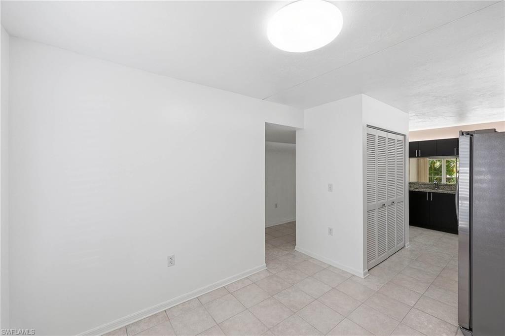 1231 Commonwealth Circle, Unit Q104 Naples, FL 34116 - Photo 18 of 33 an empty room with closet