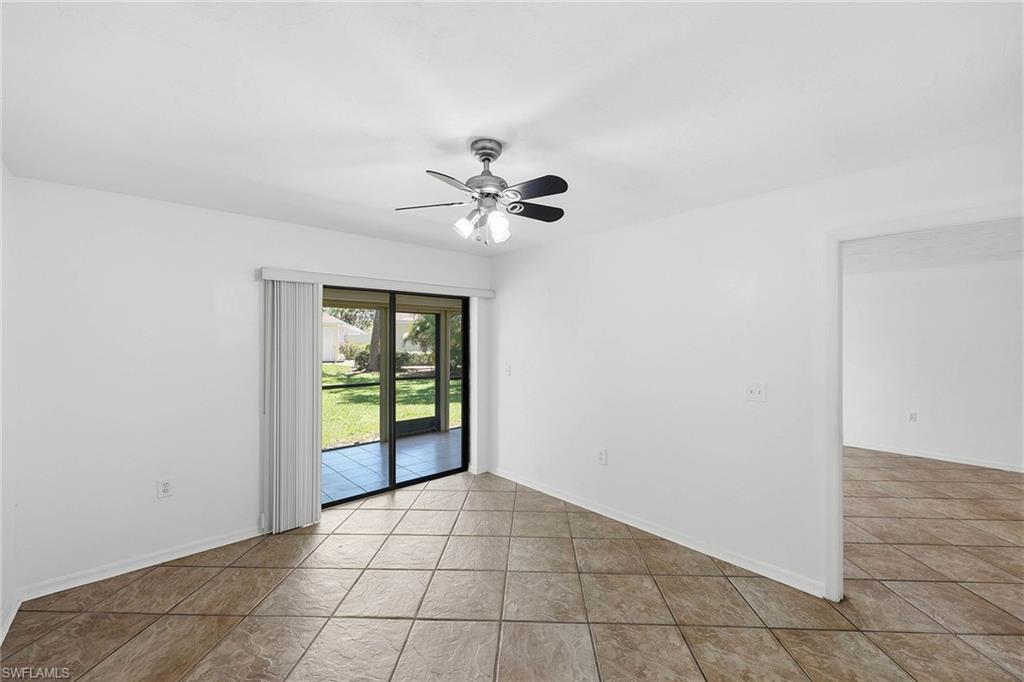 1231 Commonwealth Circle, Unit Q104 Naples, FL 34116 - Photo 20 of 33 wooden floor in an empty room with a window