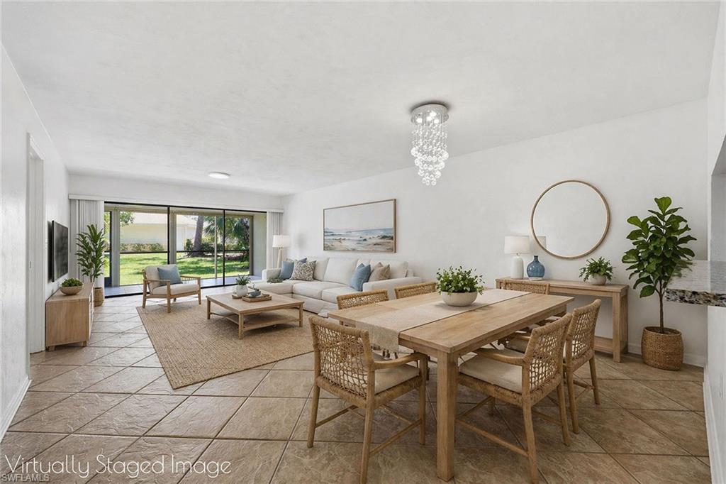 1231 Commonwealth Circle, Unit Q104 Naples, FL 34116 - Photo 2 of 33 a view of a dining room with furniture window and outside view