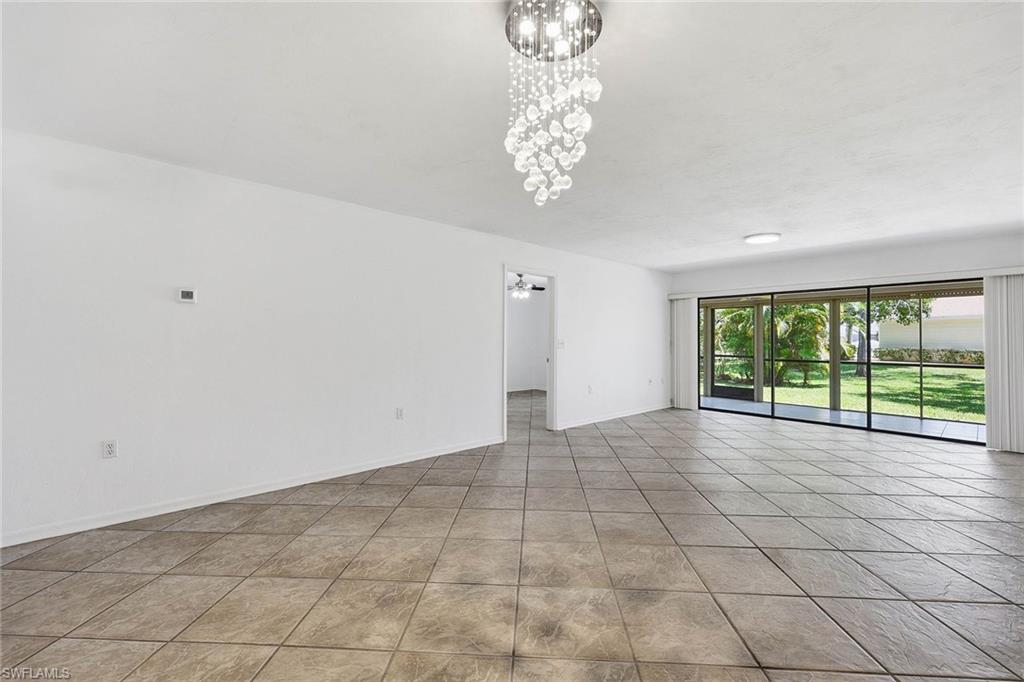 1231 Commonwealth Circle, Unit Q104 Naples, FL 34116 - Photo 10 of 33 a view of an empty room with a window