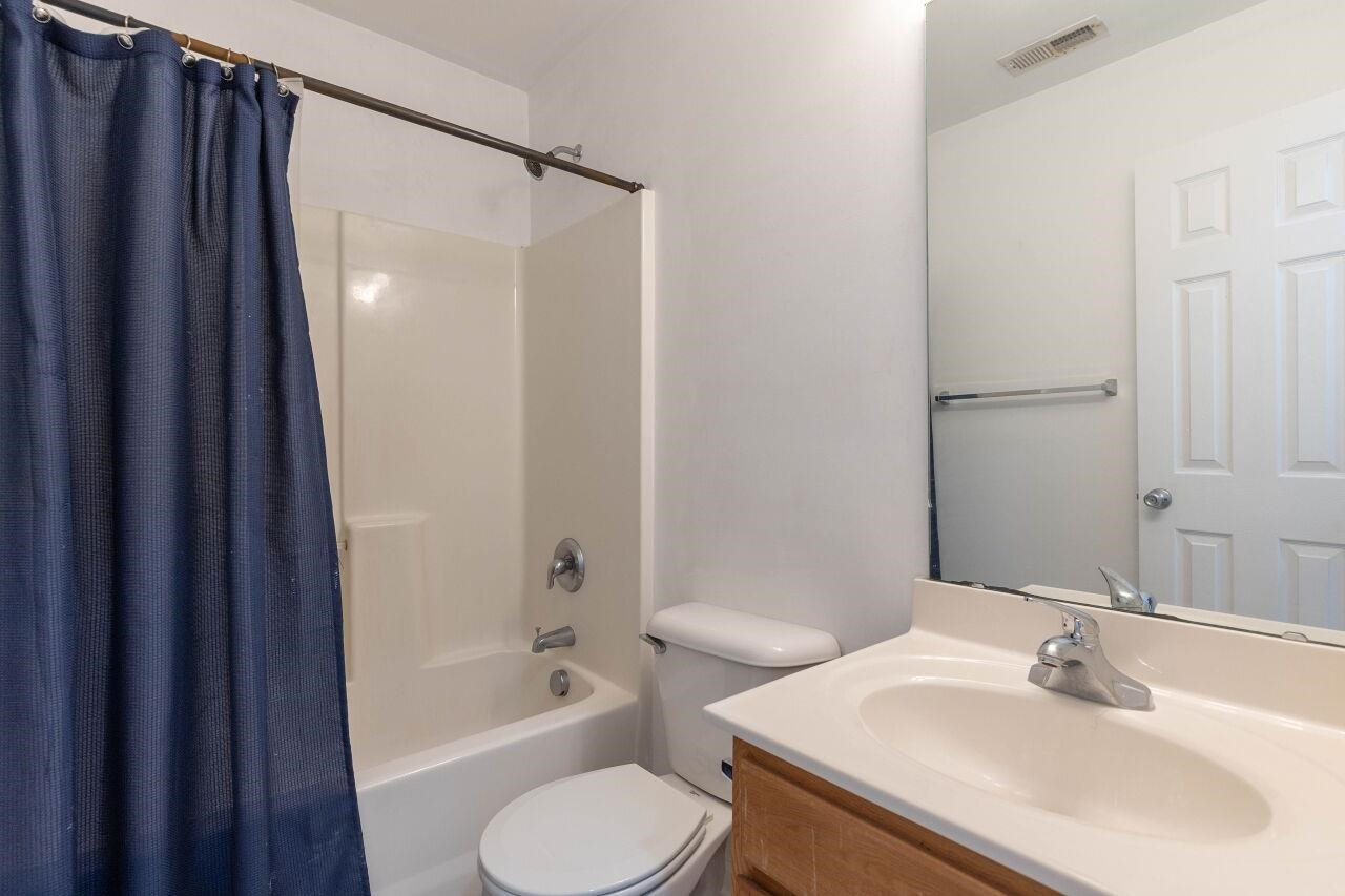 3409 Colossae Court Raleigh, NC 27610 - Photo 22 of 28 a bathroom with a sink toilet and shower
