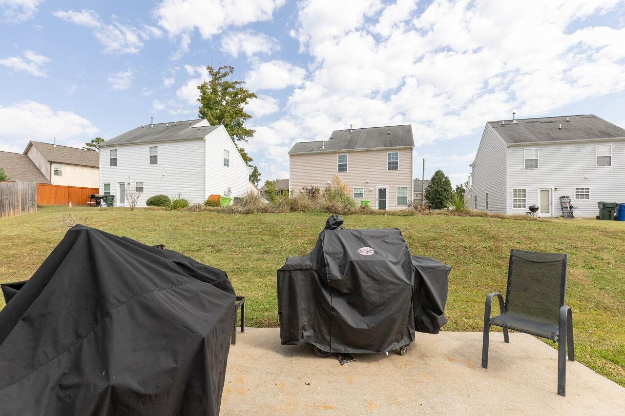 3409 Colossae Court Raleigh, NC 27610 - Photo 25 of 28 a view of a house with backyard and furniture