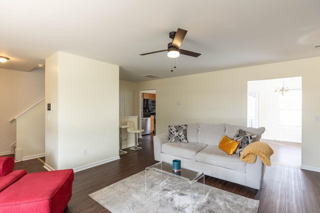 3409 Colossae Court Raleigh, NC 27610 - Photo 8 of 28 a living room with furniture and a wooden floor