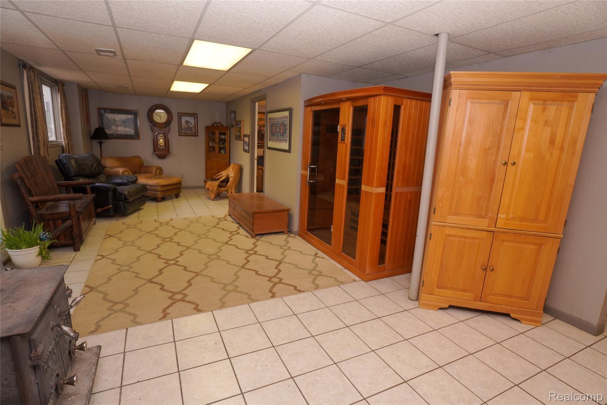 6996 Crofoot Road Fowlerville, MI 48836 - Photo 21 of 36 Finished Walkout Lower Level With Daylight Windows & Wood Burning Stove!