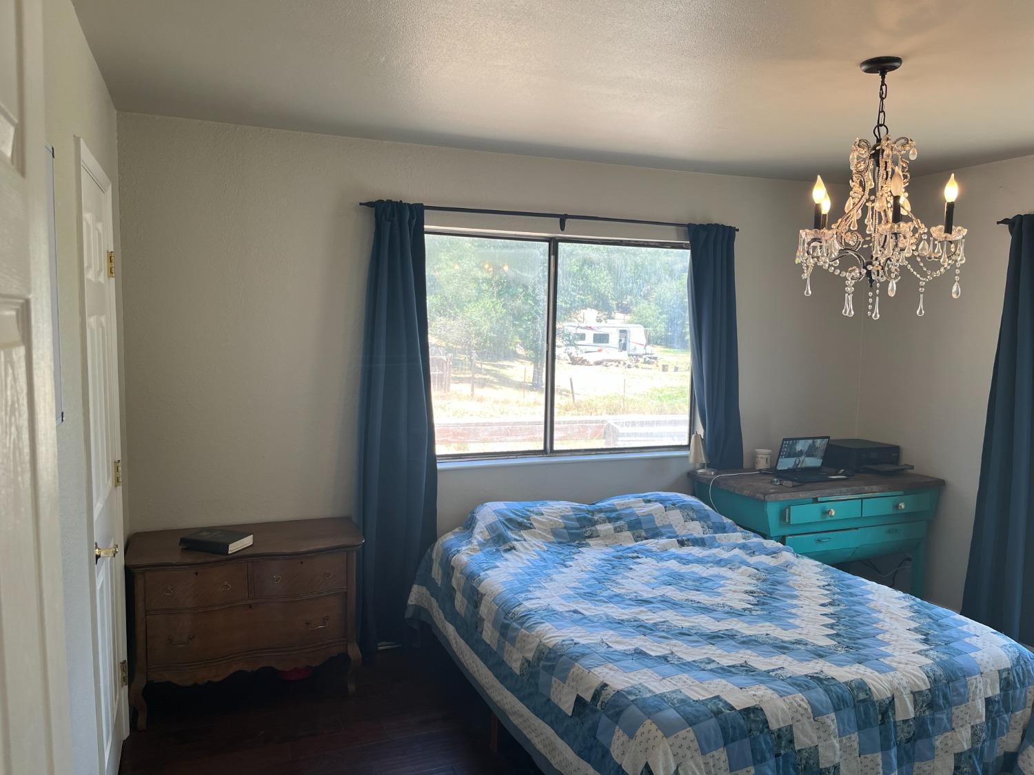 31397 Erie Road Coarsegold, CA 93614 - Photo 18 of 21 a bed sitting in a bedroom next to a window