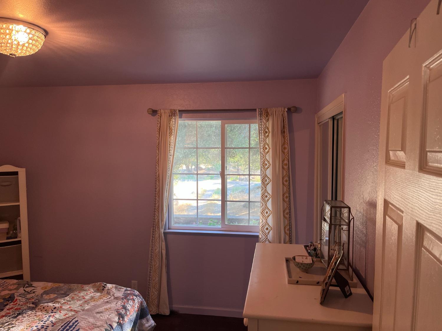 31397 Erie Road Coarsegold, CA 93614 - Photo 21 of 21 a bedroom with a bed and a window