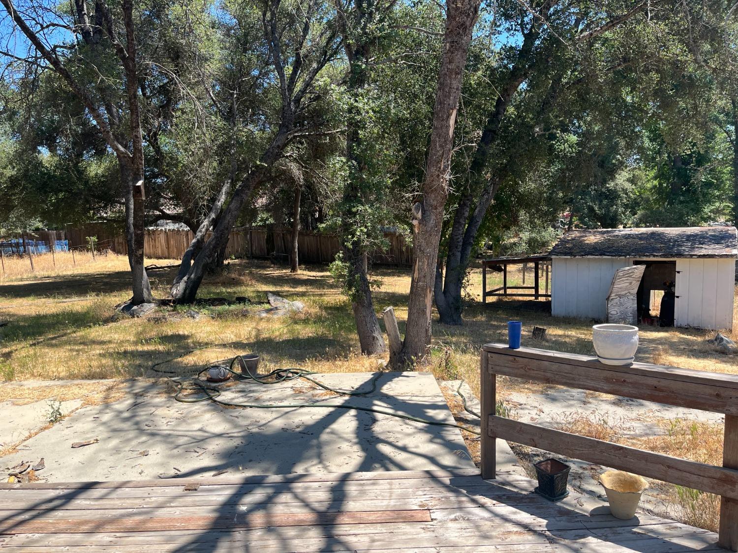 31397 Erie Road Coarsegold, CA 93614 - Photo 6 of 21 a view of a yard with wooden fence