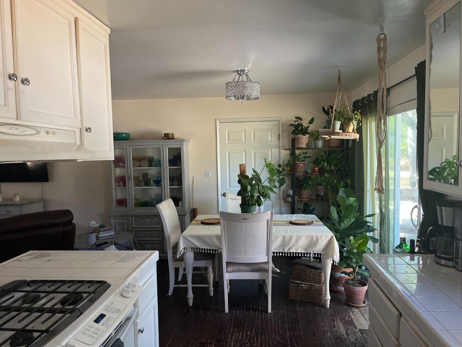 31397 Erie Road Coarsegold, CA 93614 - Photo 9 of 21 a kitchen with a table chairs stove and cabinets