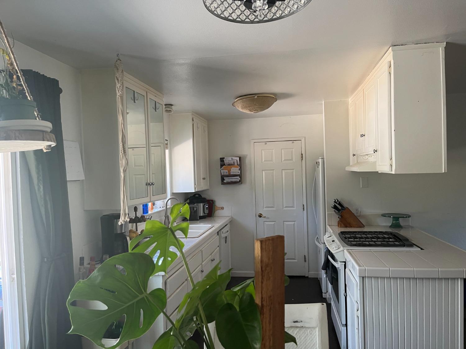 31397 Erie Road Coarsegold, CA 93614 - Photo 10 of 21 a living room with furniture and a chandelier