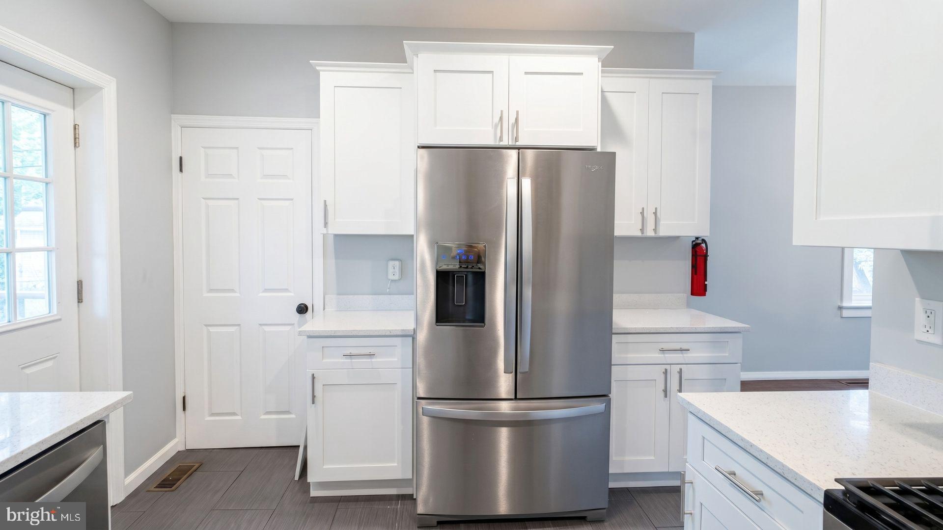 154 Andrew Street Hamilton, NJ 08610 - Photo 11 of 29 a kitchen with stainless steel appliances a refrigerator and a stove