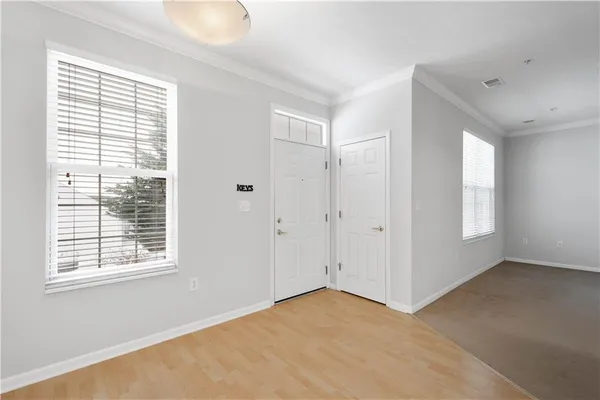 a view of an empty room with a window