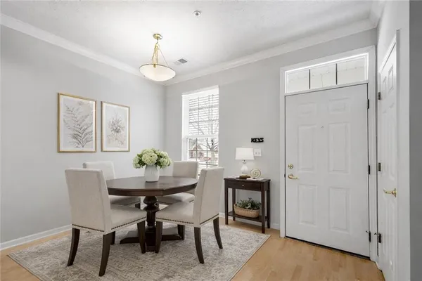 a view of a dining room with furniture and window
