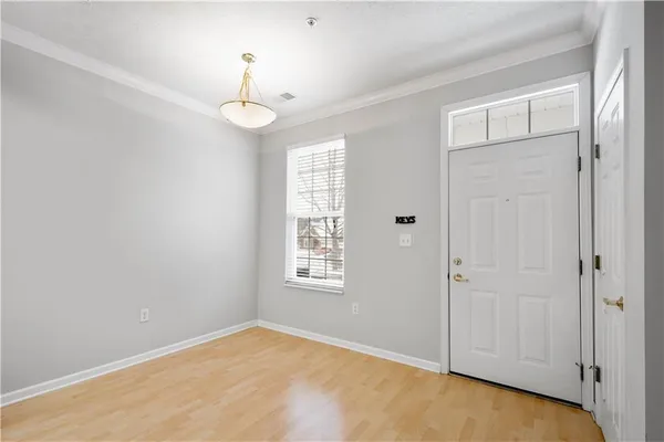 a view of an empty room with a window