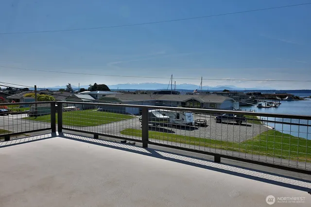 a view of a swimming pool and outdoor seating