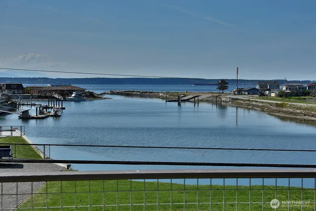 a view of a swimming pool with chairs