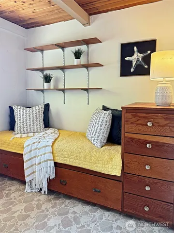 a bedroom with a bed and window