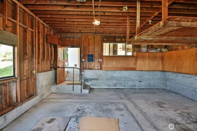 an aerial view of a house with a yard and green space