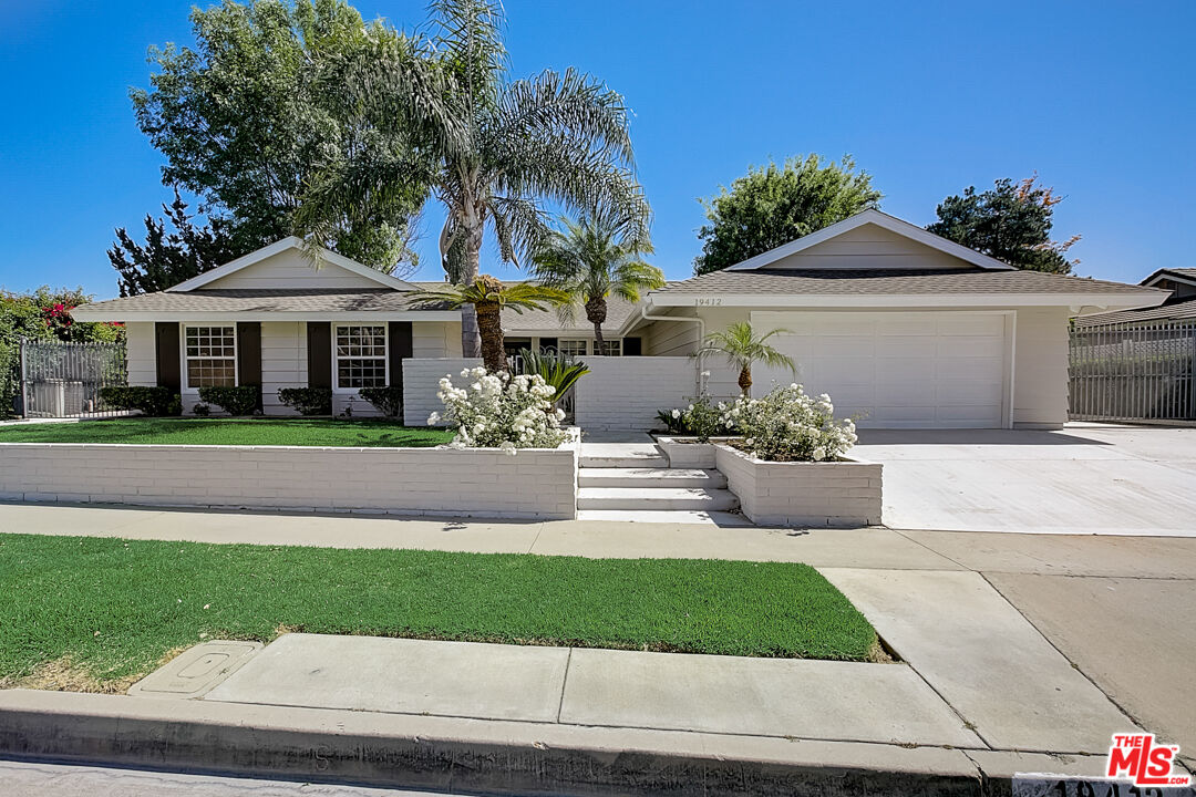 19412 Old Ranch Road Yorba Linda, CA 92886 - Photo 1 of 35 a front view of a house with a garden and potted plants