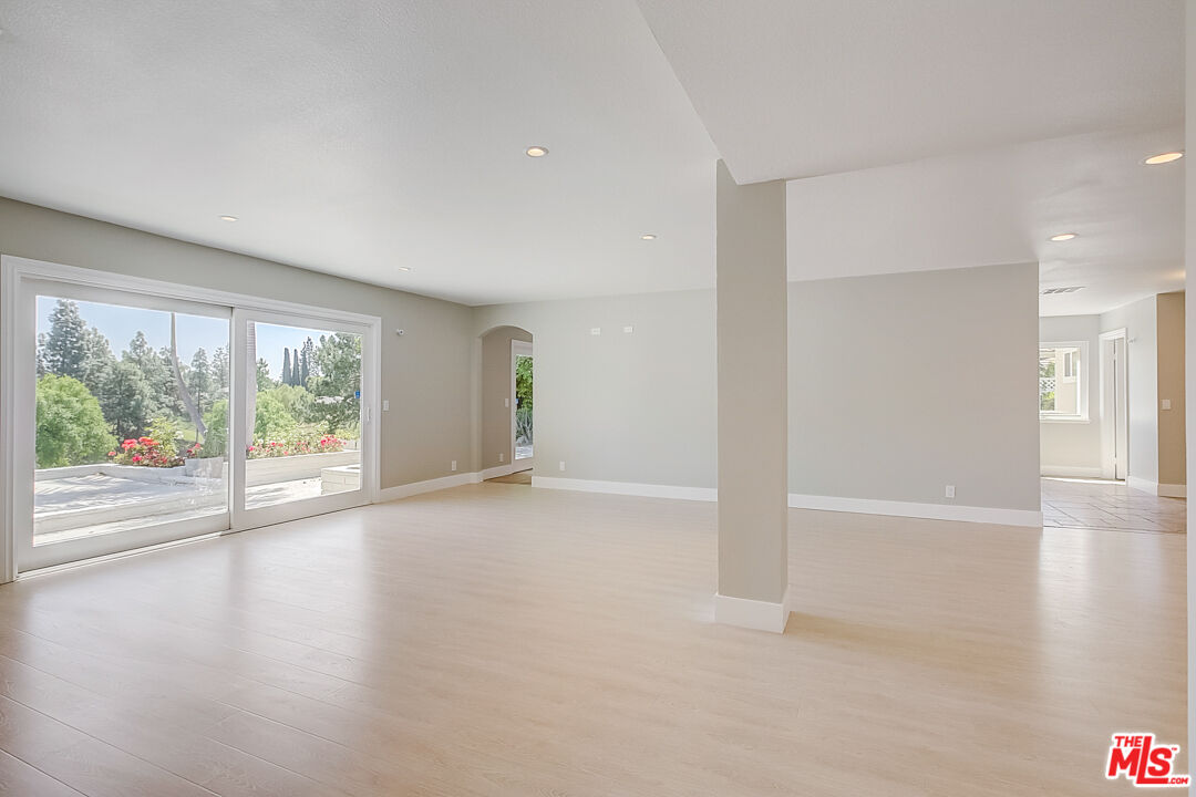 19412 Old Ranch Road Yorba Linda, CA 92886 - Photo 12 of 35 an empty room with wooden floor and windows