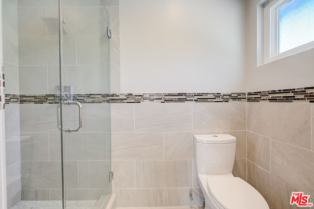 19412 Old Ranch Road Yorba Linda, CA 92886 - Photo 20 of 35 a bathroom with a toilet and a shower