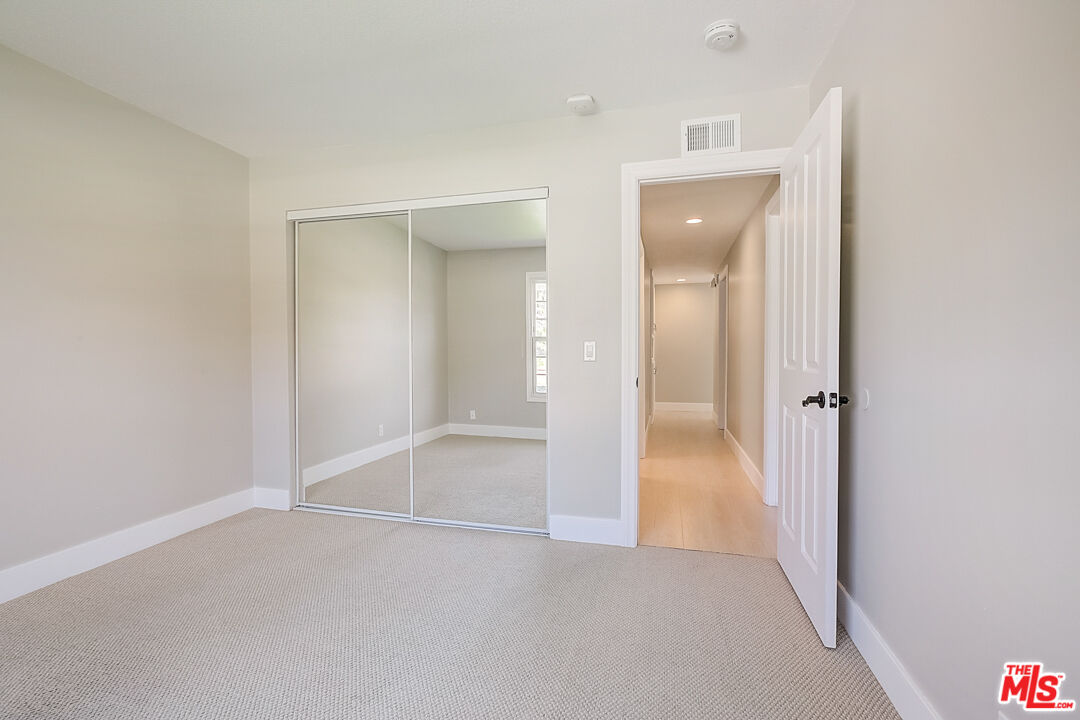 19412 Old Ranch Road Yorba Linda, CA 92886 - Photo 25 of 35 an empty room with a bathroom and mirror