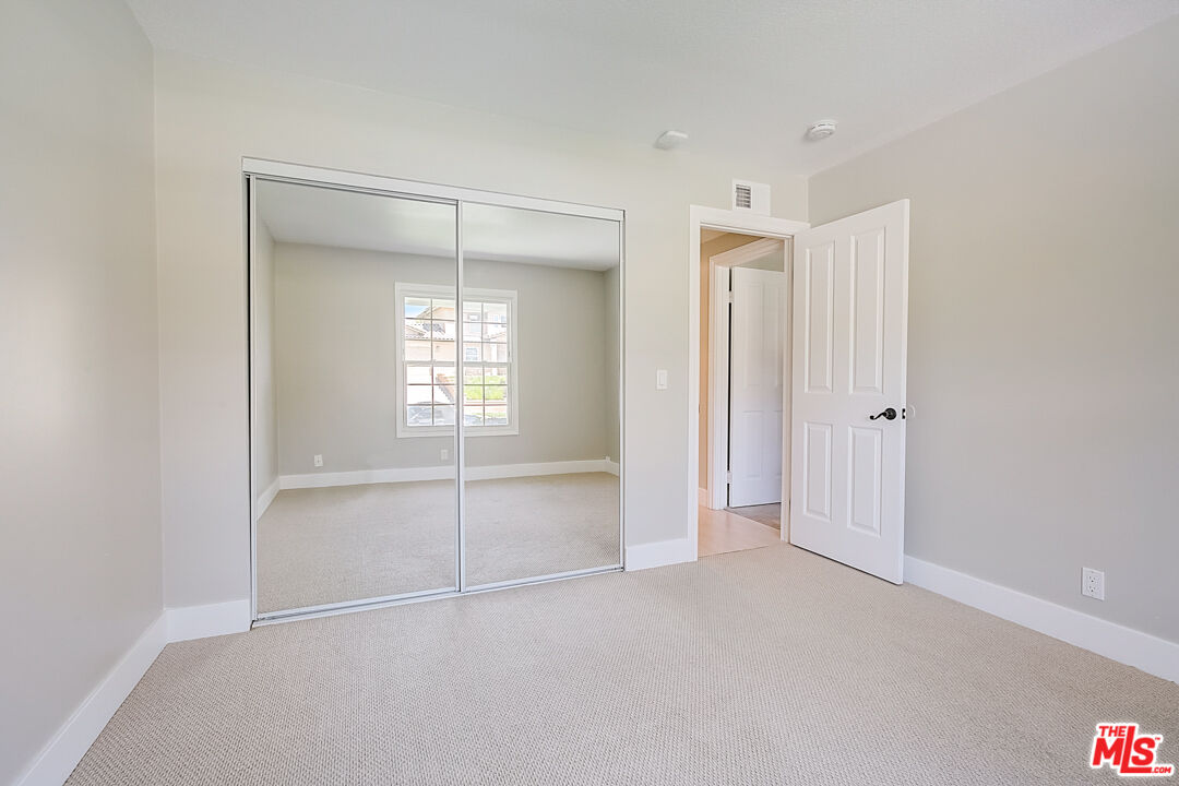 19412 Old Ranch Road Yorba Linda, CA 92886 - Photo 26 of 35 a view of an empty room with window and closet area