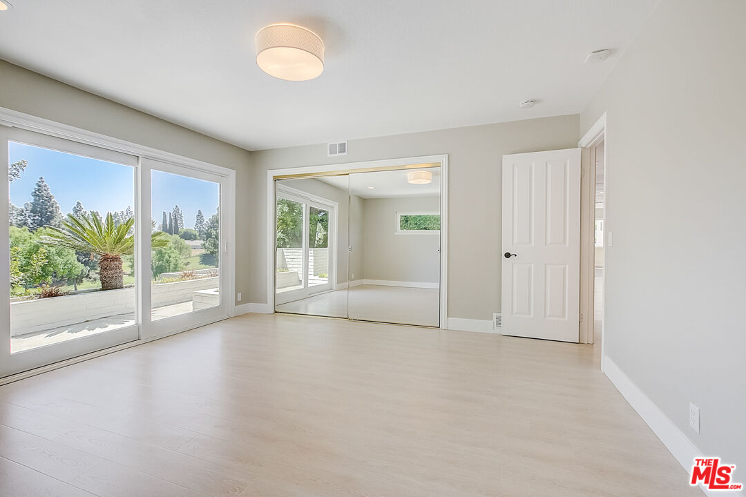 19412 Old Ranch Road Yorba Linda, CA 92886 - Photo 6 of 35 an empty room with windows and garden