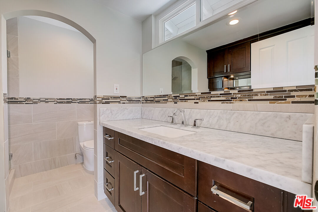 19412 Old Ranch Road Yorba Linda, CA 92886 - Photo 7 of 35 a bathroom with a sink double vanity and a mirror