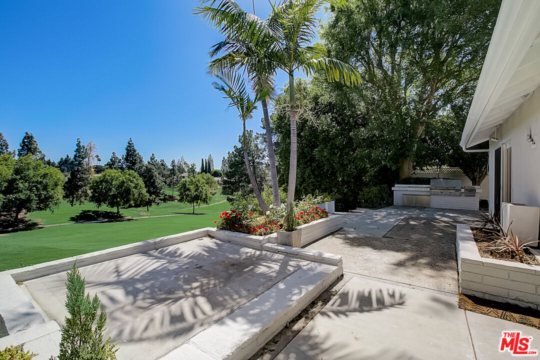 19412 Old Ranch Road Yorba Linda, CA 92886 - Photo 8 of 35 a view of a backyard with couches plants and large trees