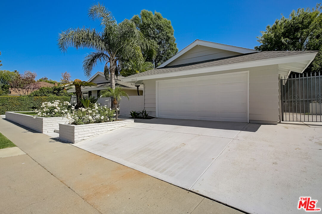 19412 Old Ranch Road Yorba Linda, CA 92886 - Photo 10 of 35 a front view of a house with a yard and garage