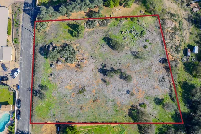 an aerial view of a houses with outdoor space