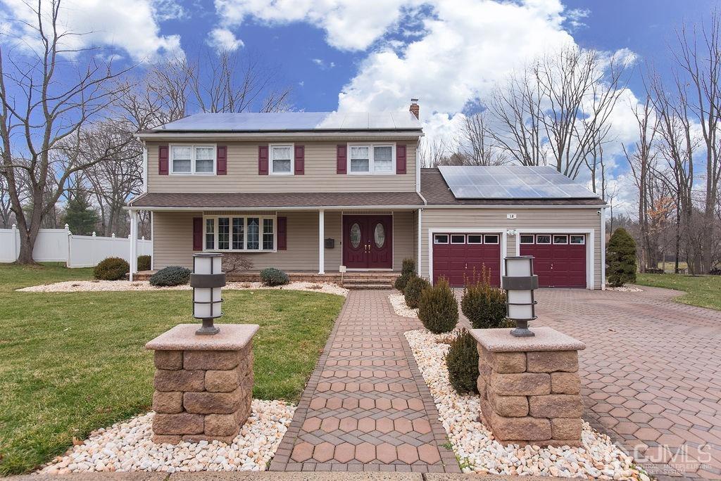 18 Layne Road Somerset, NJ 08873 - Photo 1 of 22 a front view of a house with garden and porch