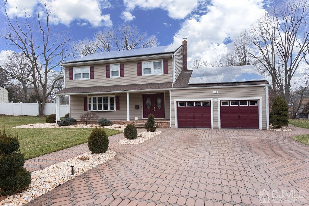 18 Layne Road Somerset, NJ 08873 - Photo 2 of 22 a front view of a house with a yard and trees