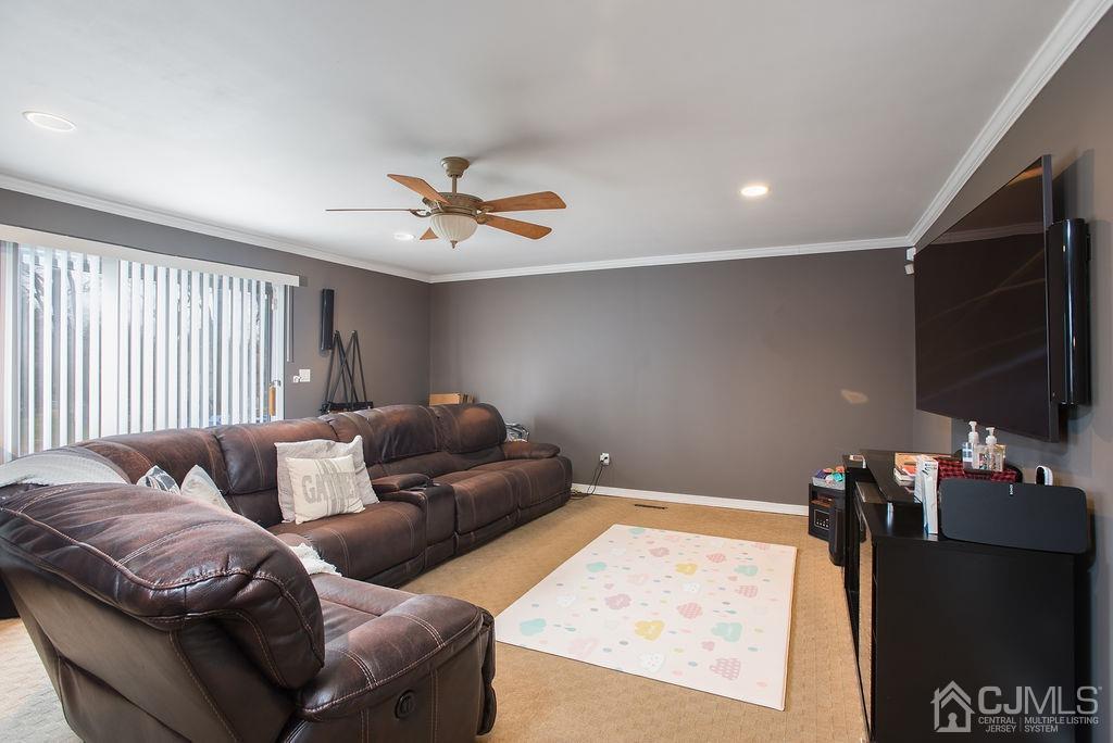 18 Layne Road Somerset, NJ 08873 - Photo 11 of 22 a living room with furniture and a flat screen tv