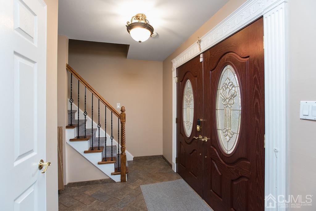 18 Layne Road Somerset, NJ 08873 - Photo 3 of 22 a view of staircase with wooden door